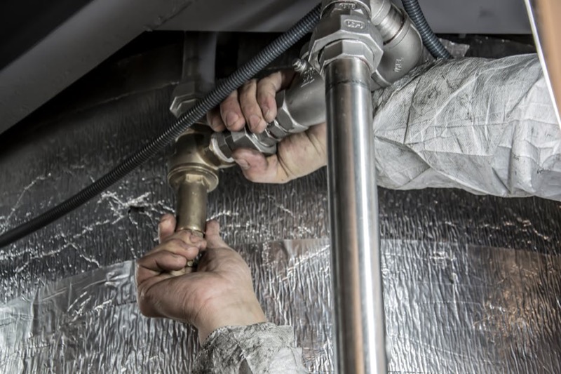 Water softener installation guide - plumber connecting pipes